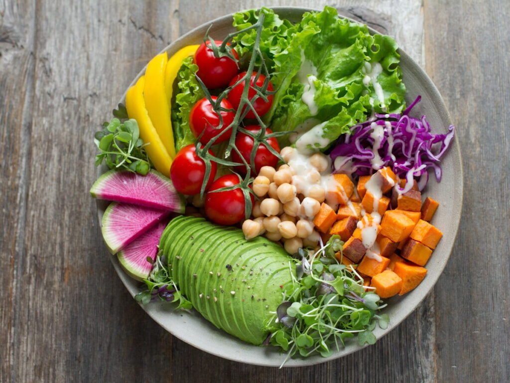 A colourful vegetable and grain bowl representing a blood-sugar-stable meal