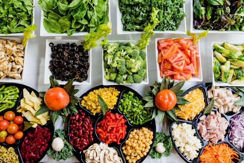 An arrangement of fresh vegetables, legumes and fibre-rich whole foods
