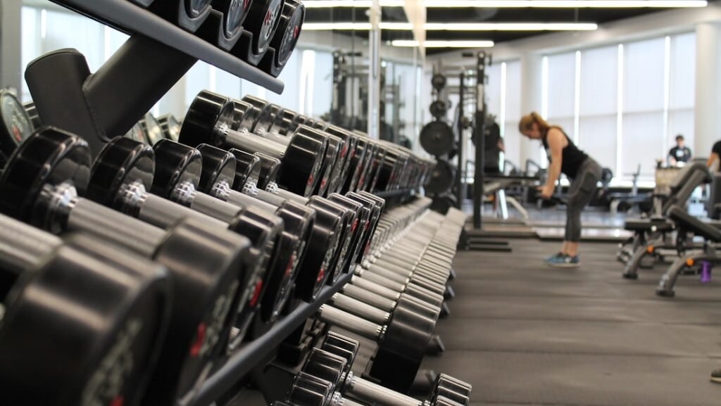 Dumbbells resting on a gym floor