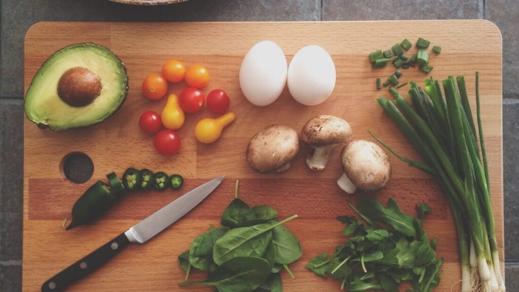 Vegetables being chopped on a kitchen board