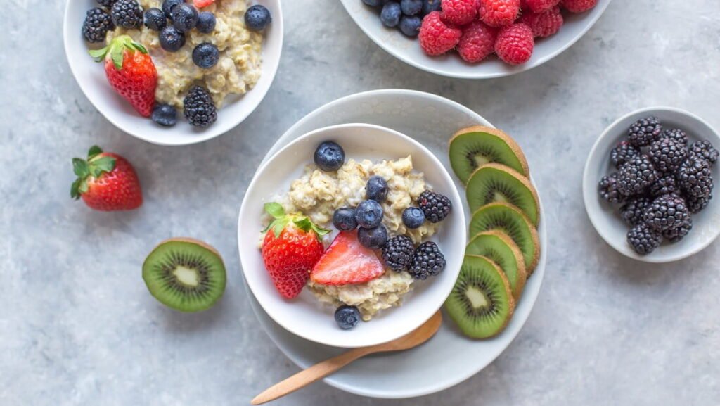 A bowl of overnight oats topped with fruit and seeds